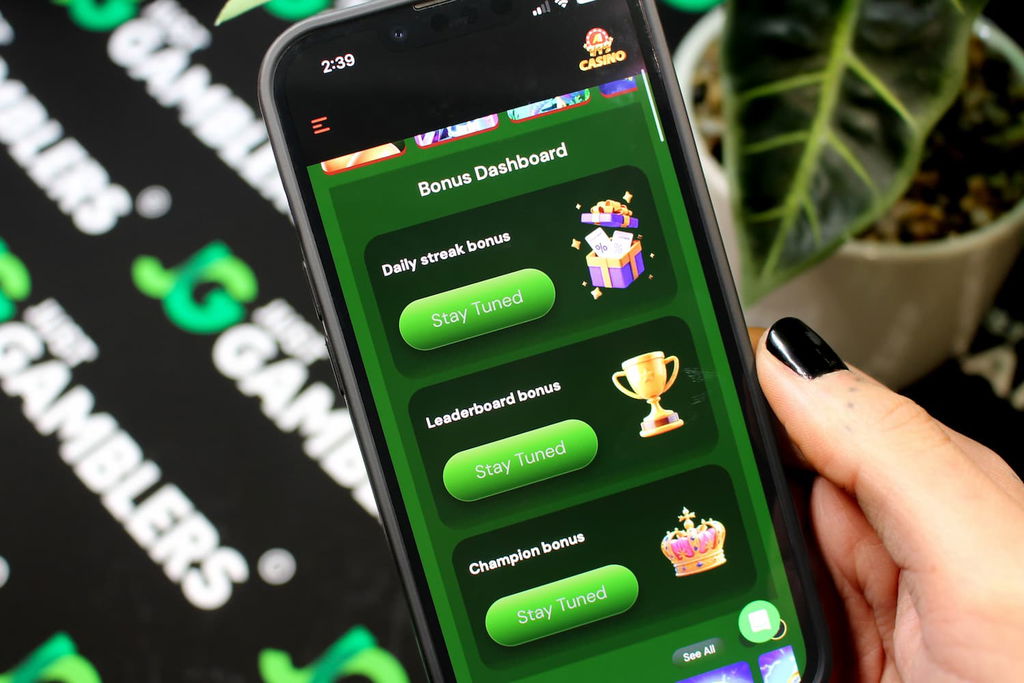 Angela Zillich holding an iPhone with the A1 casino bonuses page loaded on the webpage.