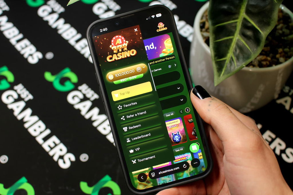 Angela Zillich holding an iPhone with the A1 casino side Menu page loaded on the webpage.