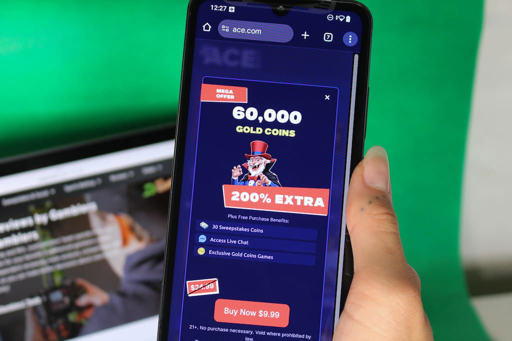 Angela Zillich holding an iPhone with the Ace casino coin store page loaded on the webpage.