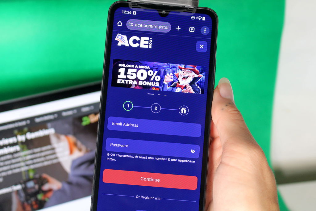 Angela Zillich holding an iPhone with the Ace casino registration page loaded on the webpage.