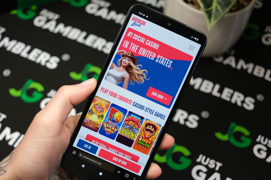 Angela Zillich holding an Android phone with the American Luck casino landing page loaded on the webpage.