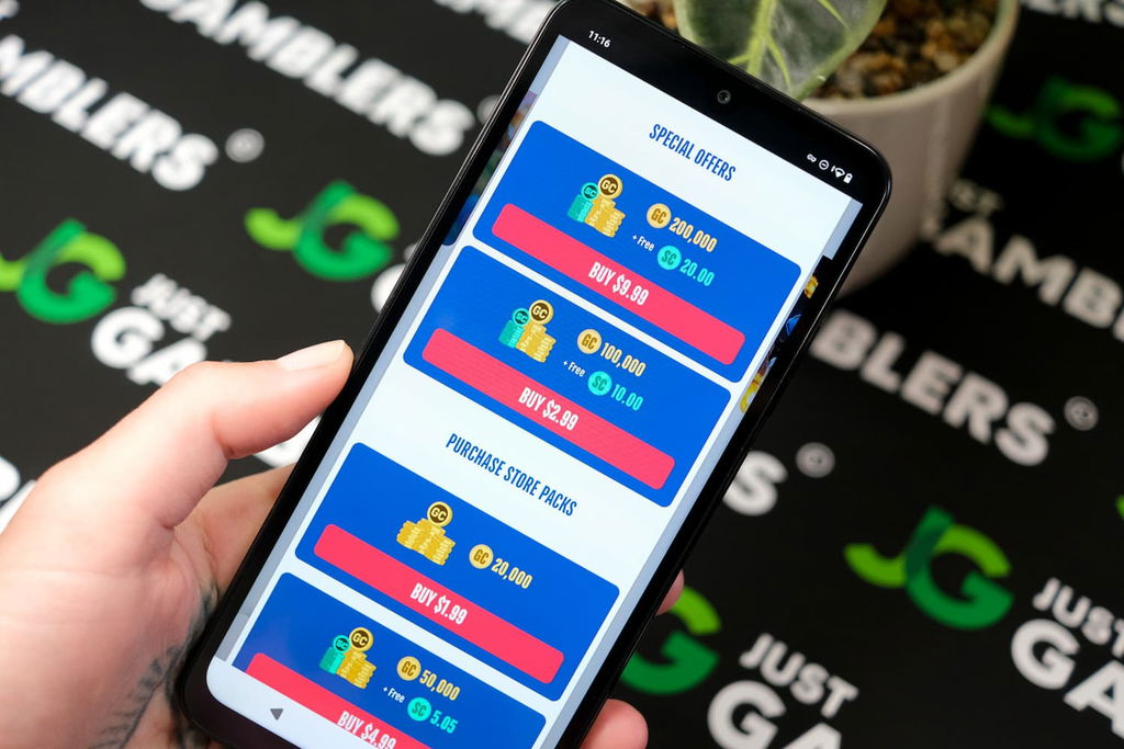 Angela Zillich holding an Android Phone with the American Luck casino Coin Store page loaded on the webpage.