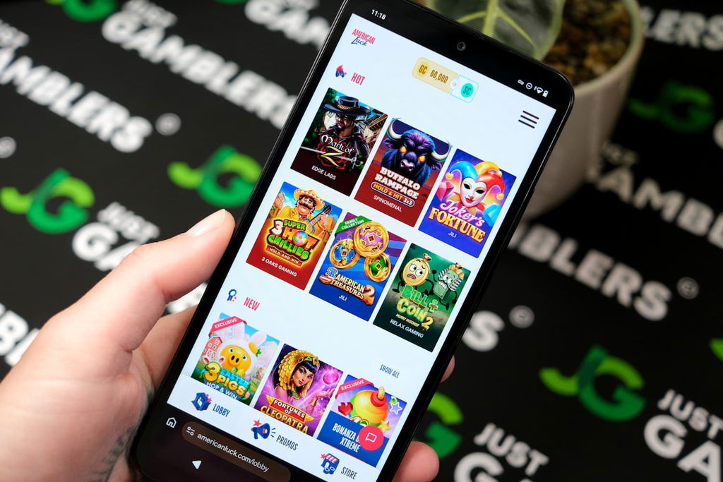 Angela Zillich holding an Android Phone with the American Luck casino gaming library page loaded on the webpage.