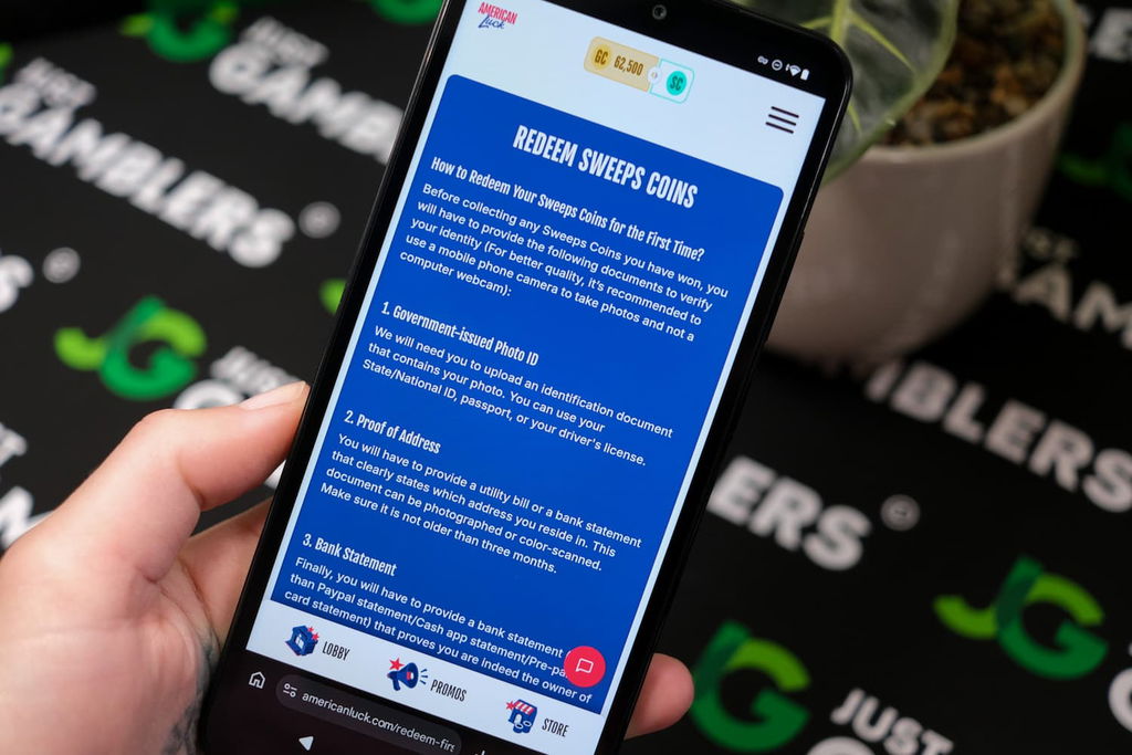 Angela Zillich holding an Android Phone with the American Luck casino redemptions page loaded on the webpage.