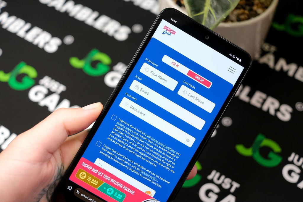 Angela Zillich holding an Android Phone with the American Luck casino registration page loaded on the webpage.