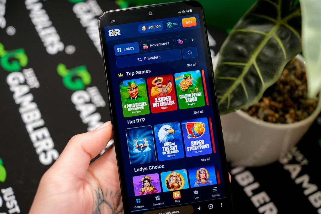 Angela Zillich holding an Android Phone with the Bank Rolla casino gaming library page loaded on the webpage.