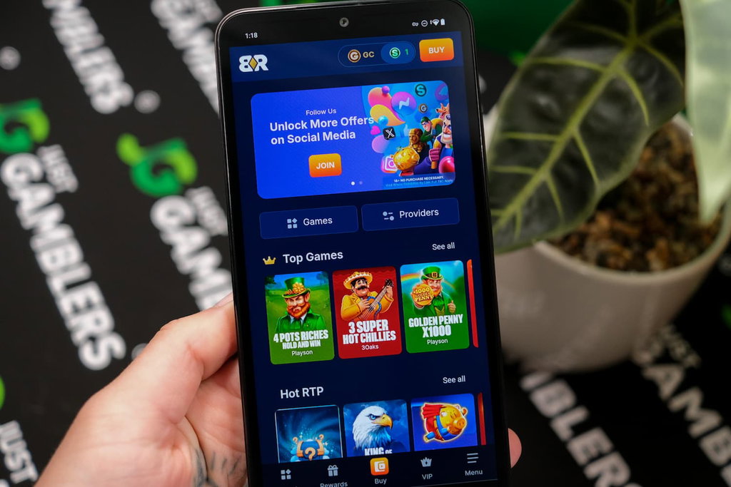 Angela Zillich holding an Android Phone with the Bank Rolla casino landing page loaded on the webpage.