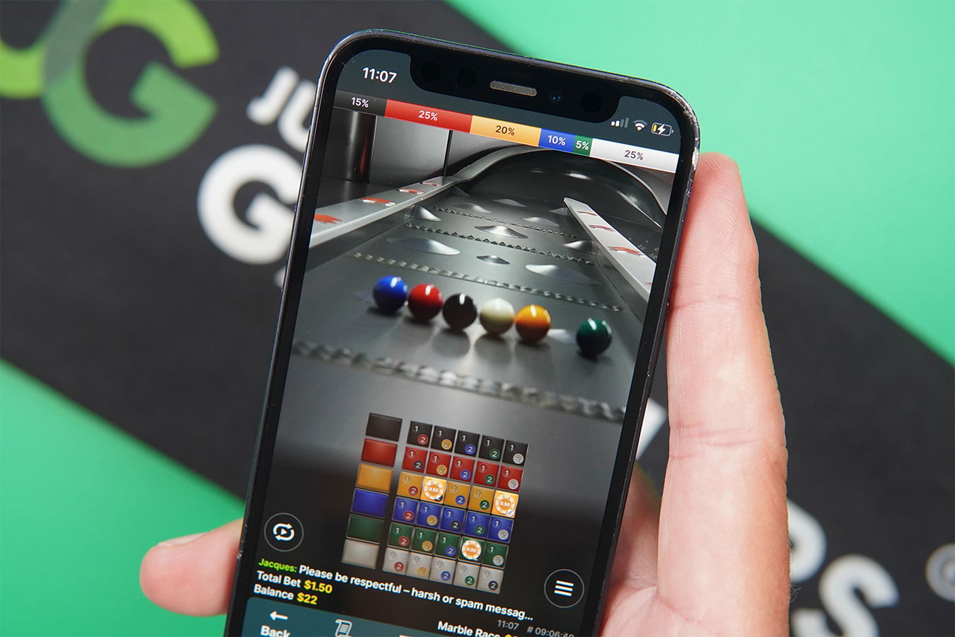 Photo of an iPhone with one of the best live casino games loaded Marble Rush