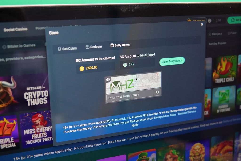 Patrik Lidin holding an iPhone with the Bitsler.io casino daily bonus page loaded on the webpage.