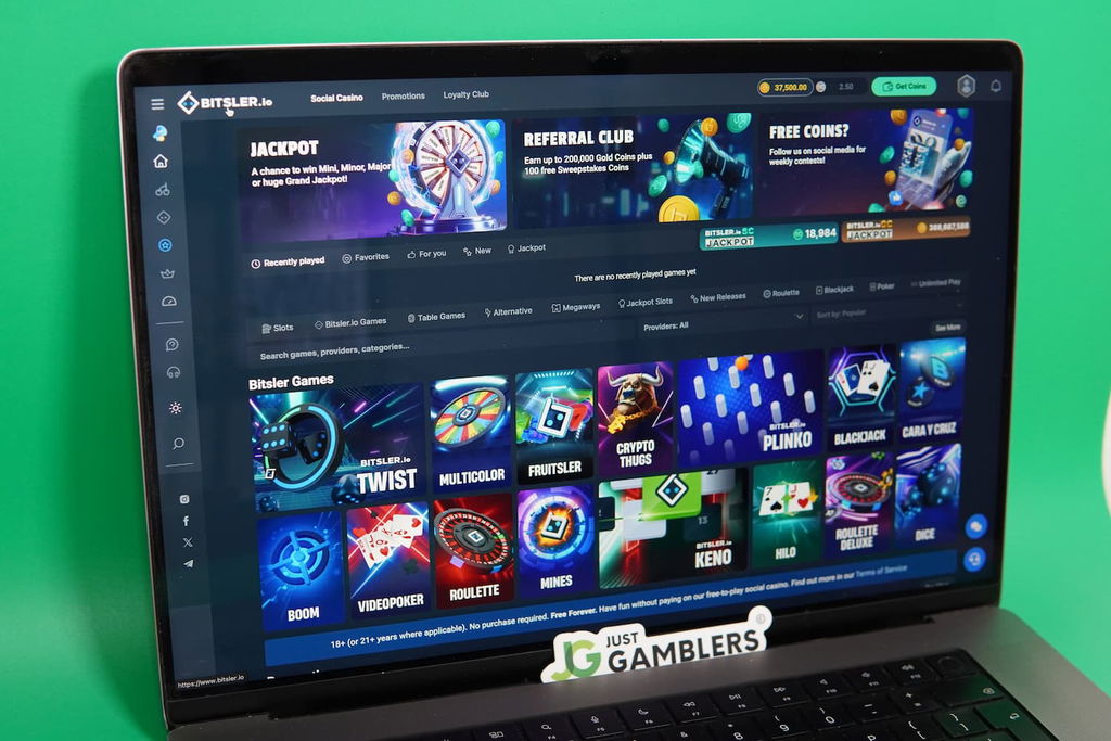 Patrik Lidin holding an iPhone with the Bitsler.io casino landing page loaded on the webpage.