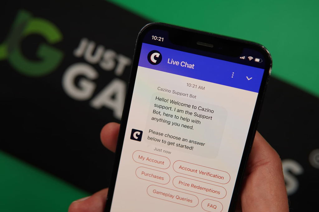 Patrik Lidin holding an iPhone with the Cazino casino support page loaded on the webpage.