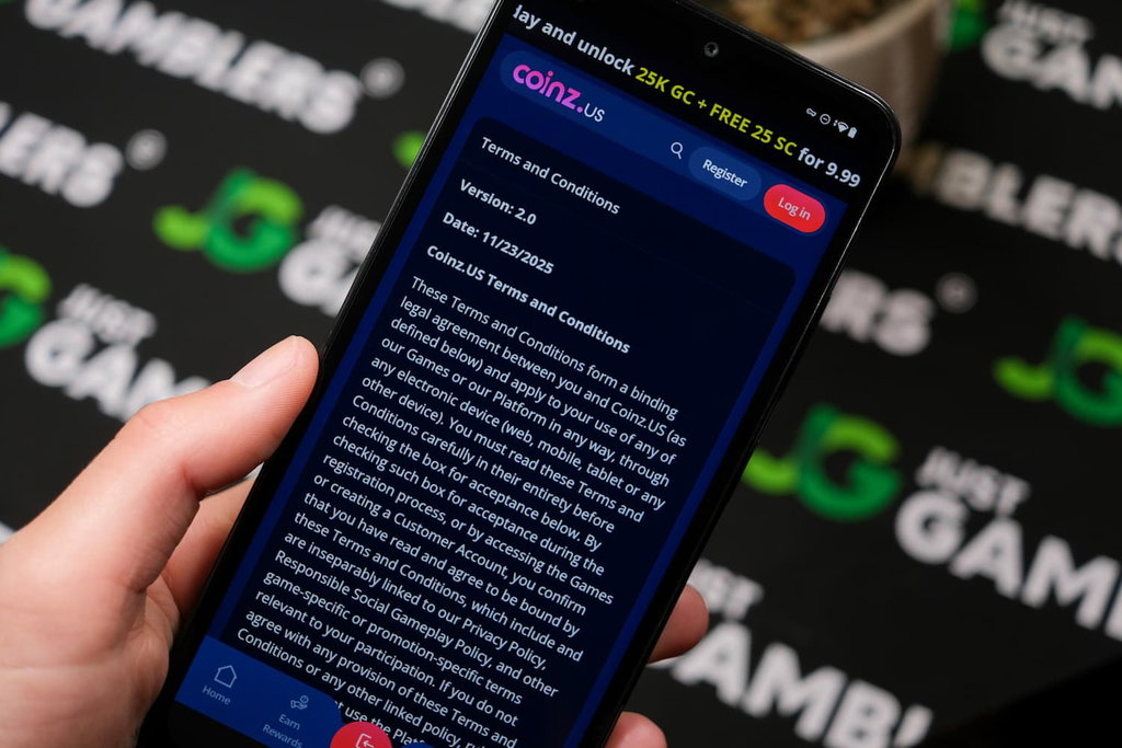Angela Zillich holding an Android Phone with Coinz.us casino Terms and Conditions page loaded on the webpage.