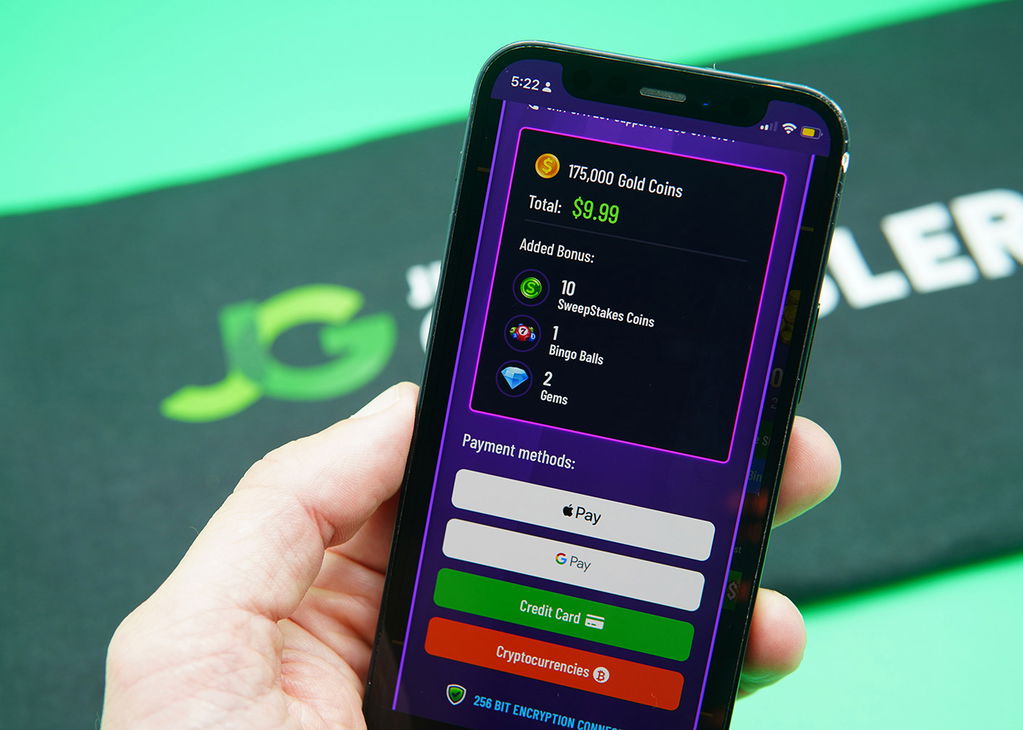 Patrik Lidin holding an iPhone when purchasing coins on DingDingDing casino.