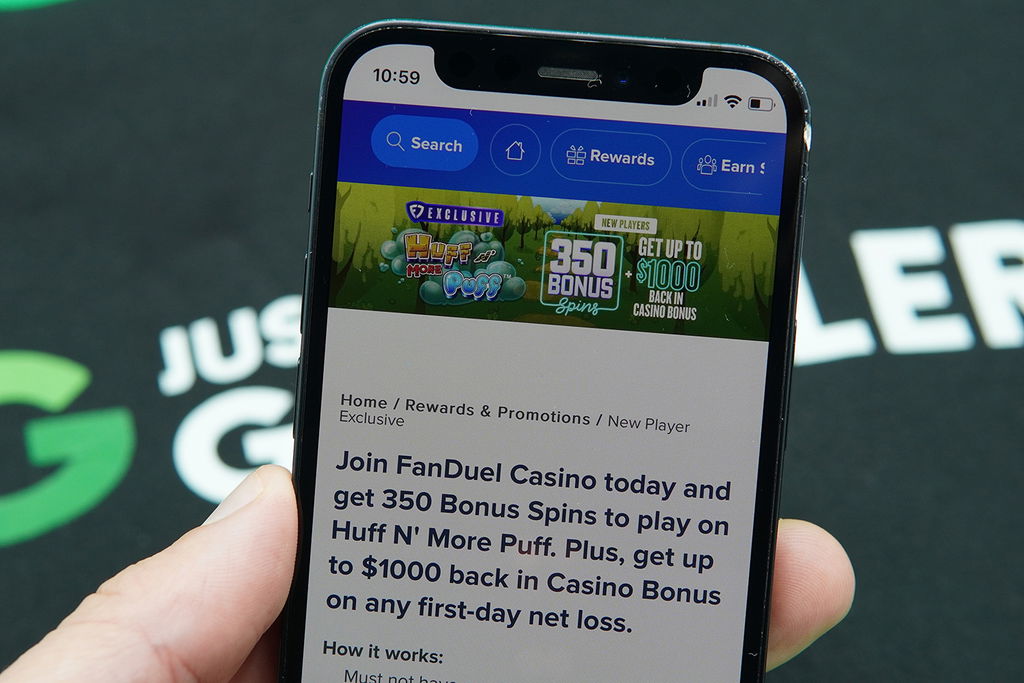 Photo of Patrik Lidin holding iPhone with FanDuel NJ welcome bonus loaded.