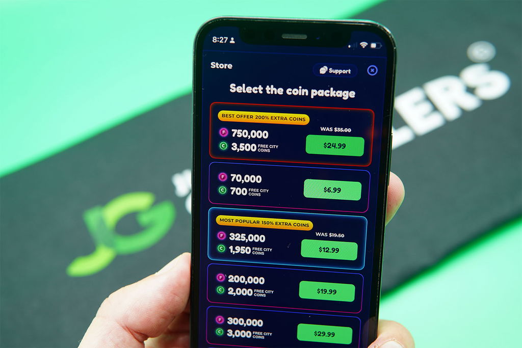 Patrik Lidin holding an iPhone showing offers for FunzCity coin packages.