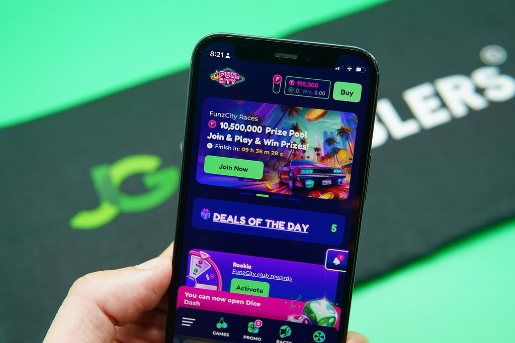 Photo of Patrik Lidin holding an iPhone to show how the FunzCity looks.