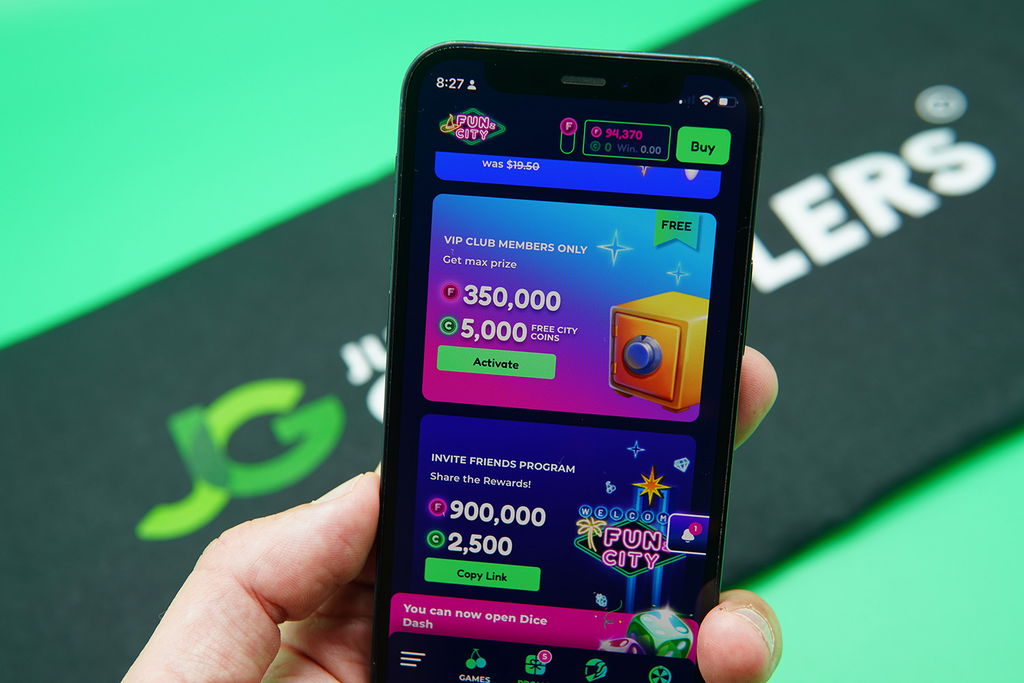 Patrik Lidin holding an iPhone with the FunzCity rewards page loaded on the webpage.