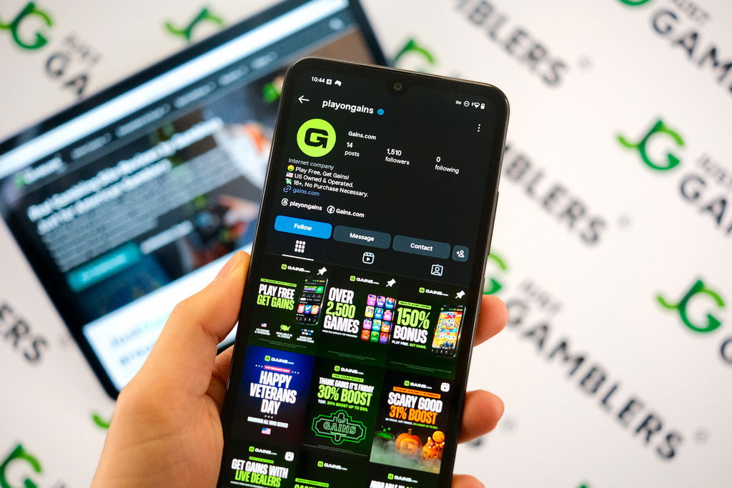 Angela Zillich holding an Android Phone with the Gains casino Instagram page loaded on the webpage.