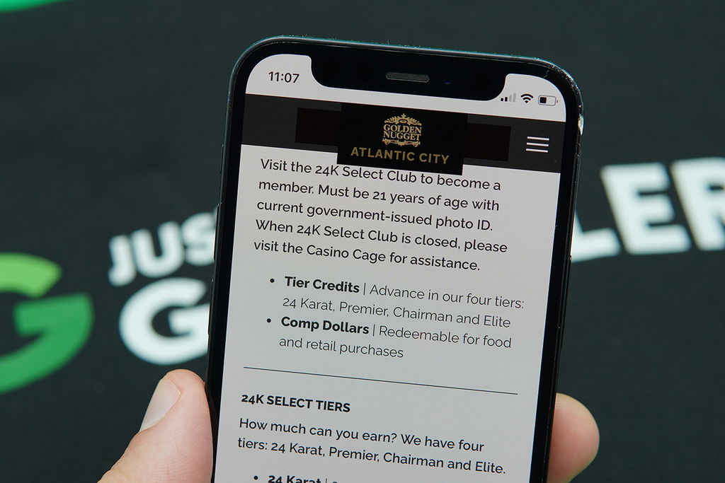 Photo of Patrik Lidin holding an iPhone with the Golden Nugget NJ loyalty program loaded.