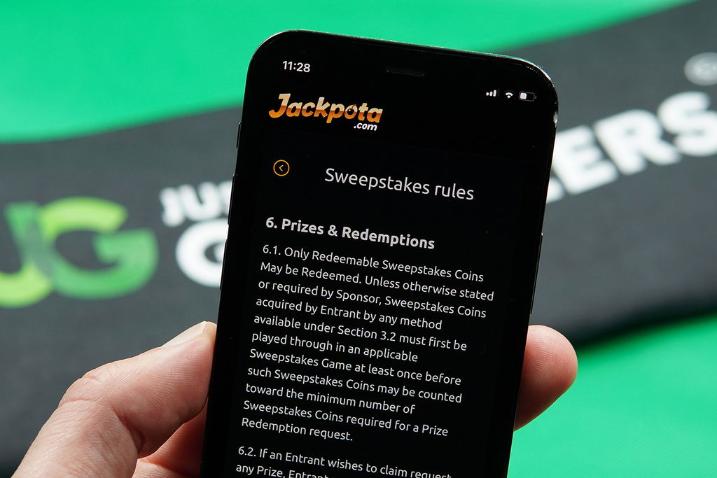 Photo of Patrik Lidin showing the Jackpota Terms and Conditions for minimum SC cashout rules.