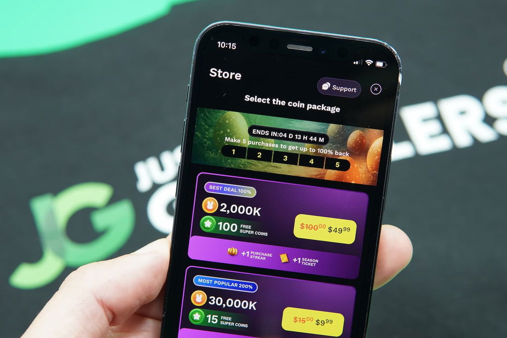 Patrik Lidin holding an iPhone with the JackpotRabbit casino Purchases Page loaded on the webpage.