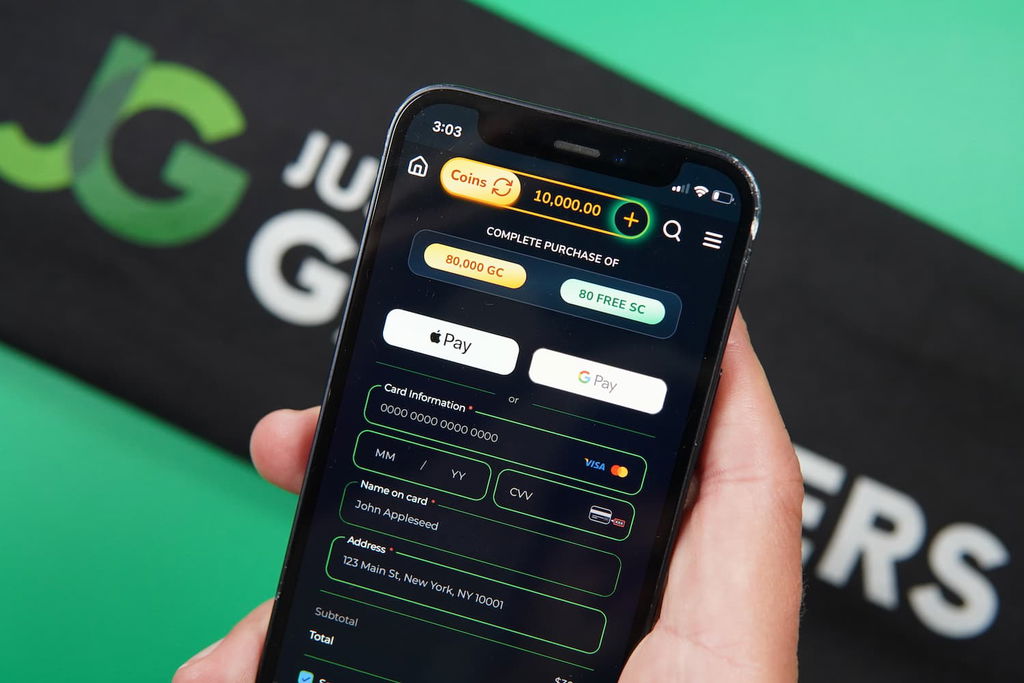 Patrik Lidin holding an iPhone with the Jumbo88 casino mobile payment page loaded on the webpage.