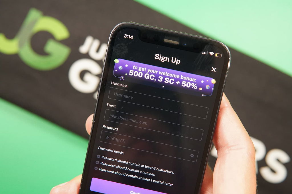 Patrik Lidin holding an iPhone with the Legendz casino registration page loaded on the webpage.