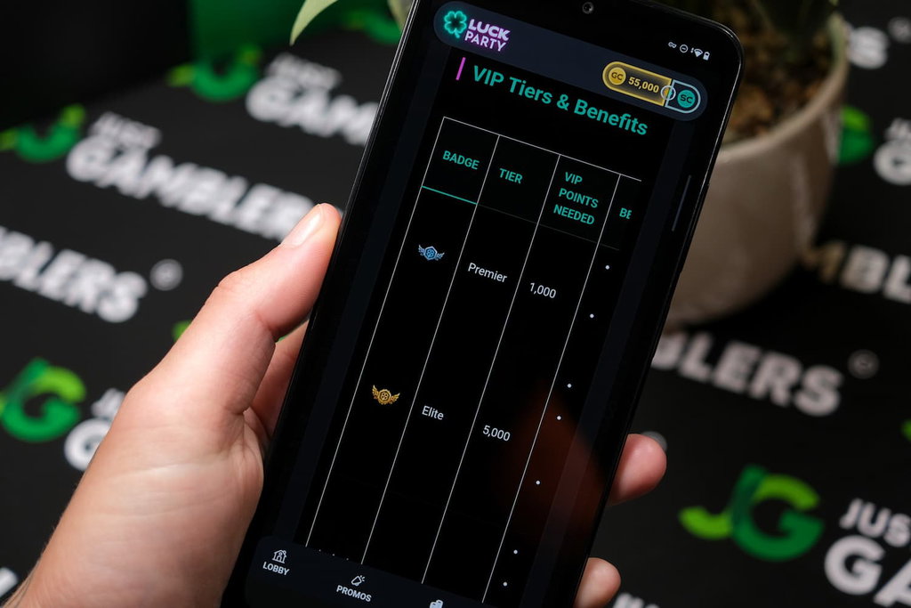 Angela Zillich holding an Android Phone with Luck Party casino VIP Tiers page loaded on the webpage.
