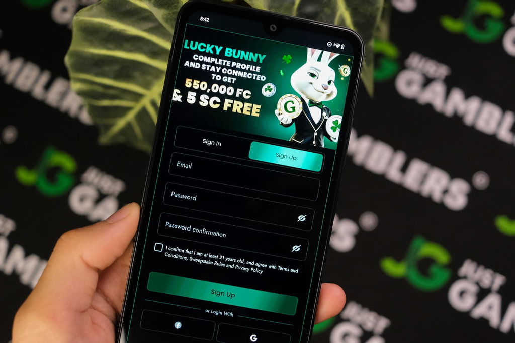 Angela Zillich holding an Android Phone with Lucky Bunny casino registration page loaded on the webpage.