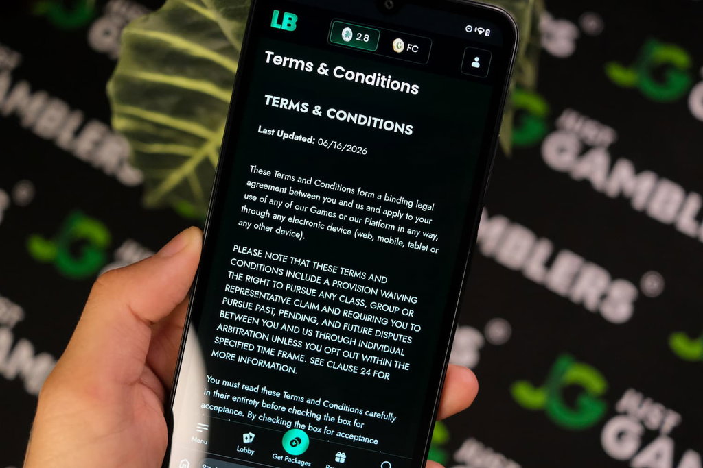 Angela Zillich holding an Android Phone with Lucky Bunny casino Terms and Conditions page loaded on the webpage.