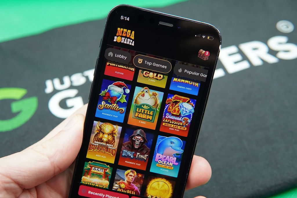 Patrik Lidin holding an iPhone with Mega Bonanza game library showing.