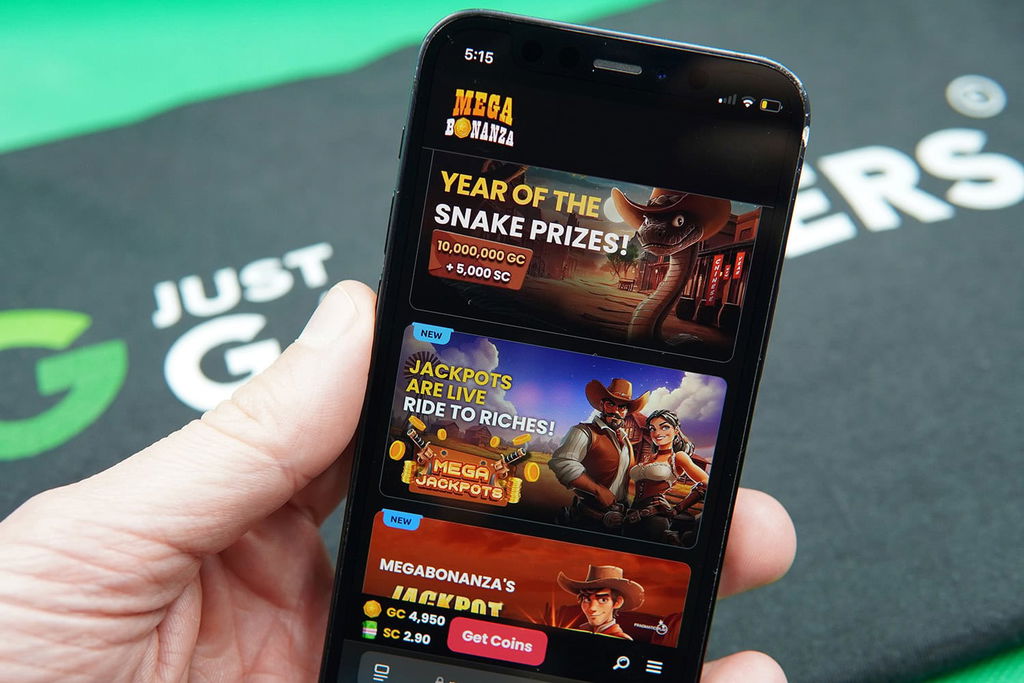 Patrik Lidin holding an iPhone with the Mega Bonanza rewards page loaded on the webpage.