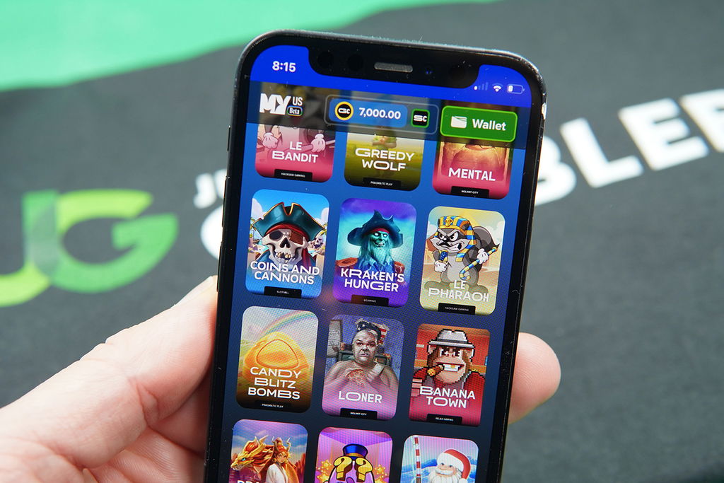 Patrik Lidin holding an iPhone with MyPrize game library showing.