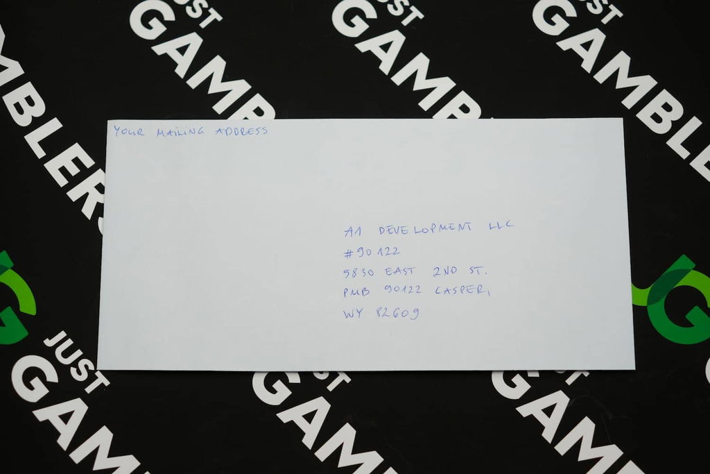 Photo of what you need to complete the NoLimitCoins mail-in request envelope.