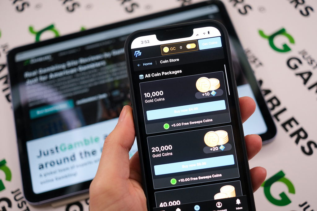 Angela Zillich holding an iPhone with the PeakPlay casino Coin Store page loaded on the webpage.