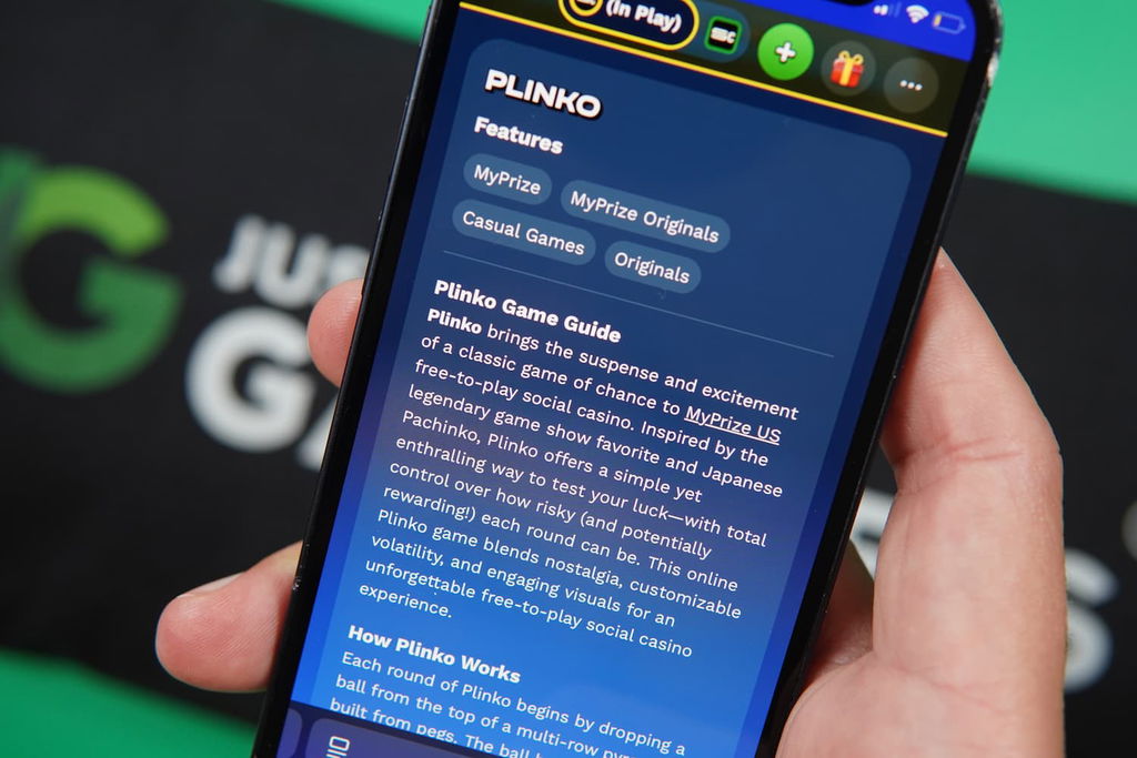 Photo of Patrik Lidin holding an iPhone showing a Plinko game description.