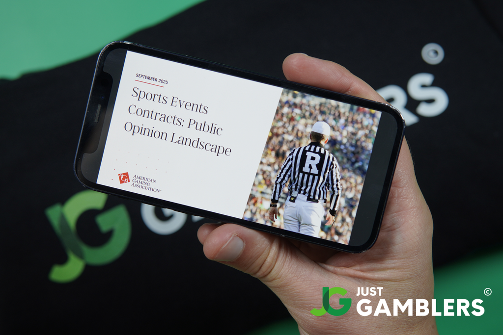 Photo of Patrik Lidin holding an iPhone with AGA prediction market report loaded.