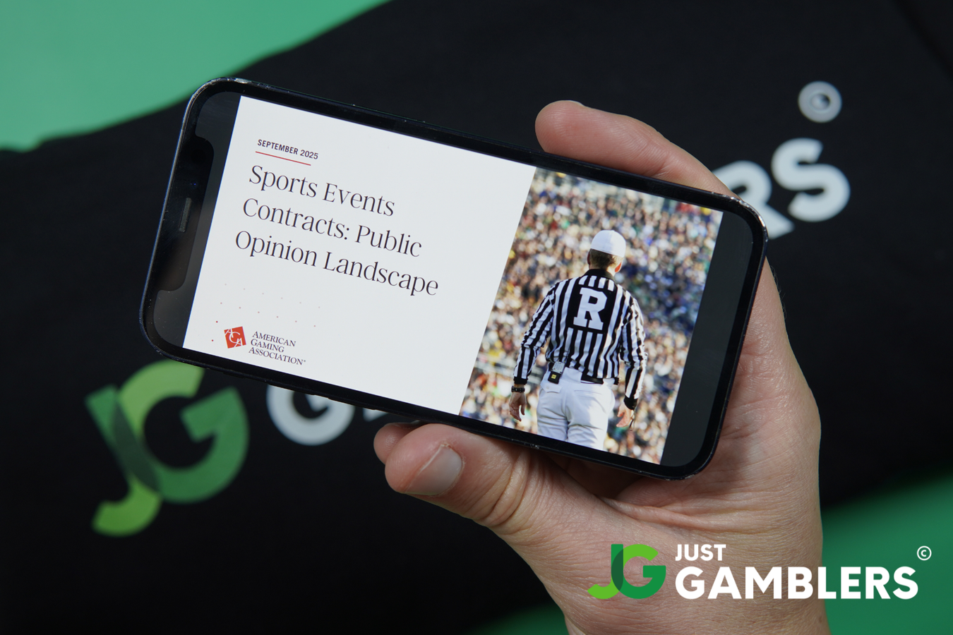 Photo of Patrik Lidin holding an iPhone with AGA prediction market report loaded.