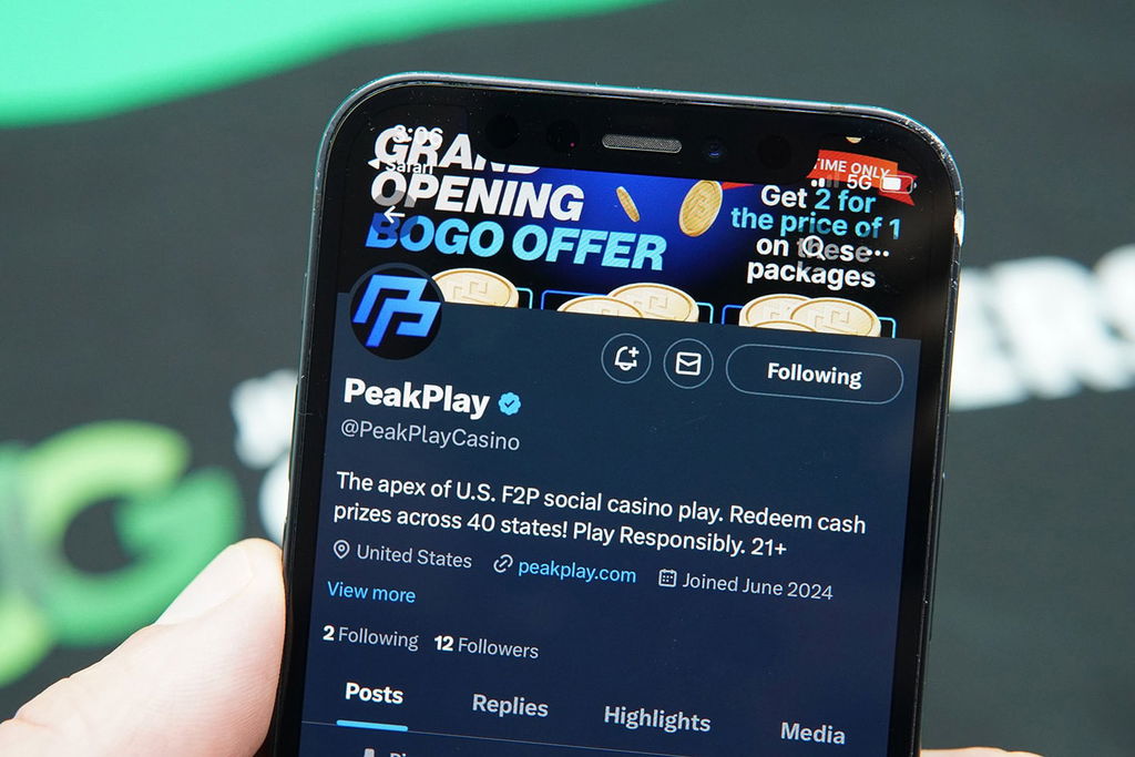 Photo of Patrik Lidin holding his iPhone showing a con related to new sweepstakes casinos.