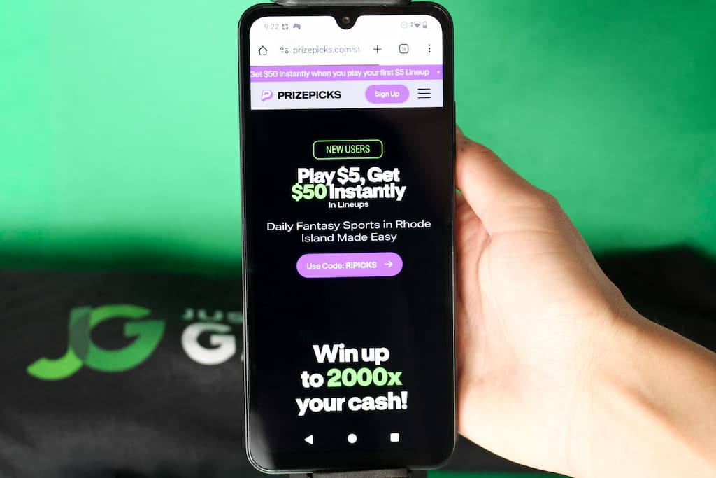 Photo of Angela Zillich with RI DFS site loaded, PrizePicks.