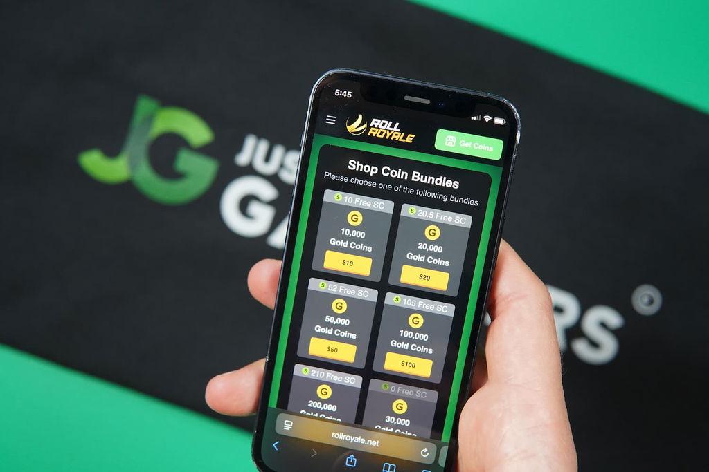 Patrik Lidin holding an iPhone with the Roll Royale casino coins store page loaded on the webpage.