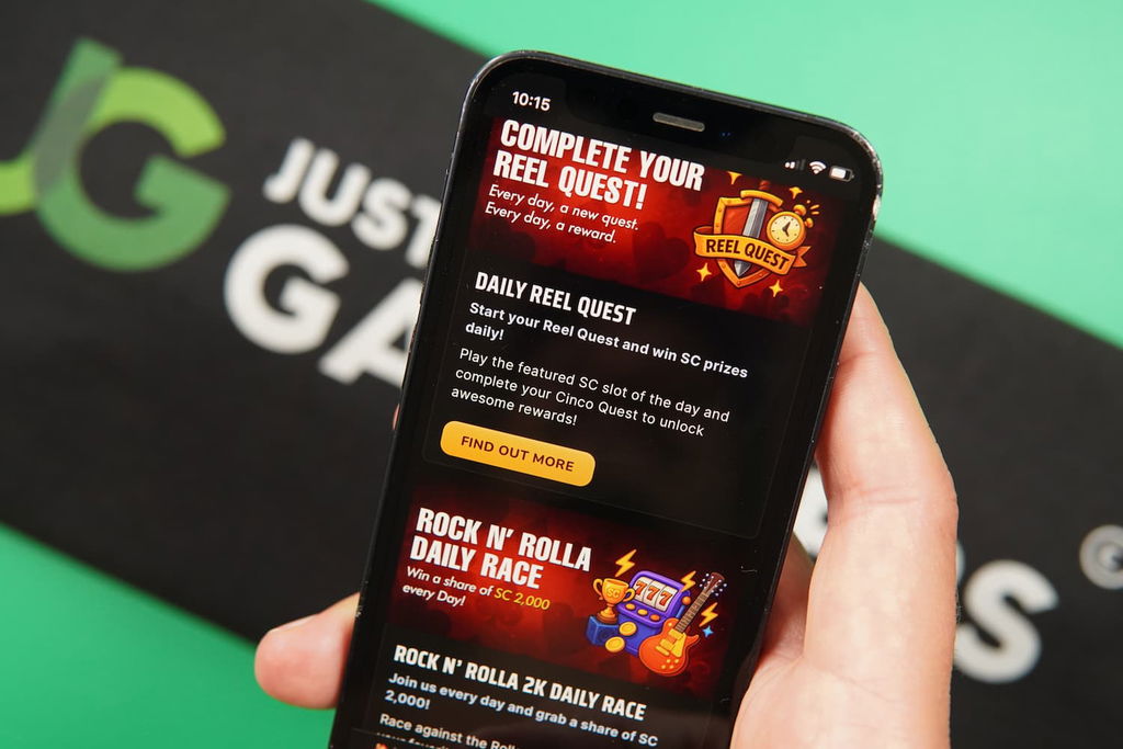 Patrik Lidin holding an iPhone with the Rolla casino promotions page loaded on the webpage.