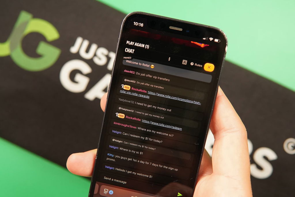 Patrik Lidin holding an iPhone with the Rolla casino support page loaded on the webpage.