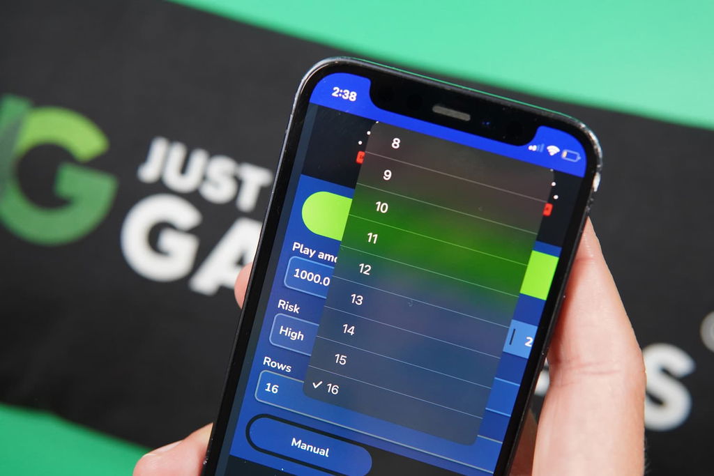 Photo of Patrik Lidin holding an iPhone showing the Row option in Plinko.