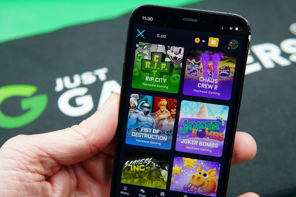 Patrik Lidin holding an iPhone with Runestake game library showing.