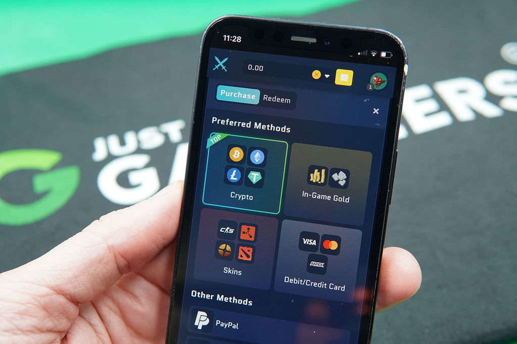 Photo of Patrik Lidin holding an iPhone with Runestake Coin Store