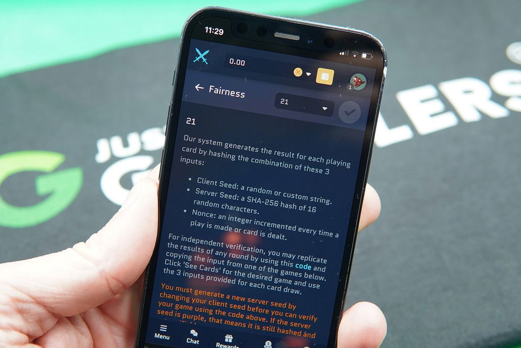 Patrik Lidin holding an iPhone with Runestake provably fair page showing.