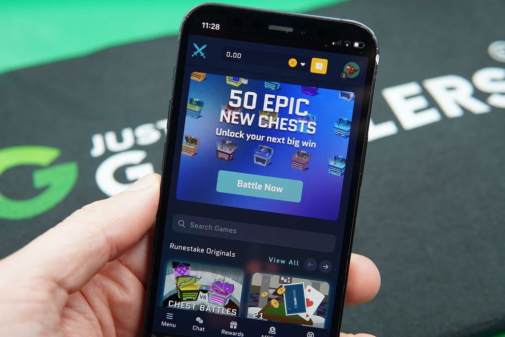 Photo of Patrik Lidin holding an iPhone to show how the Runestake casino looks.