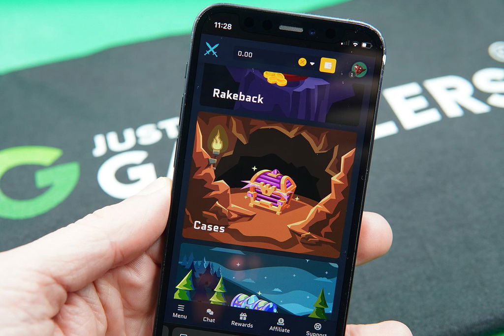 Patrik Lidin holding an iPhone with the Runestake rewards page loaded on the webpage.