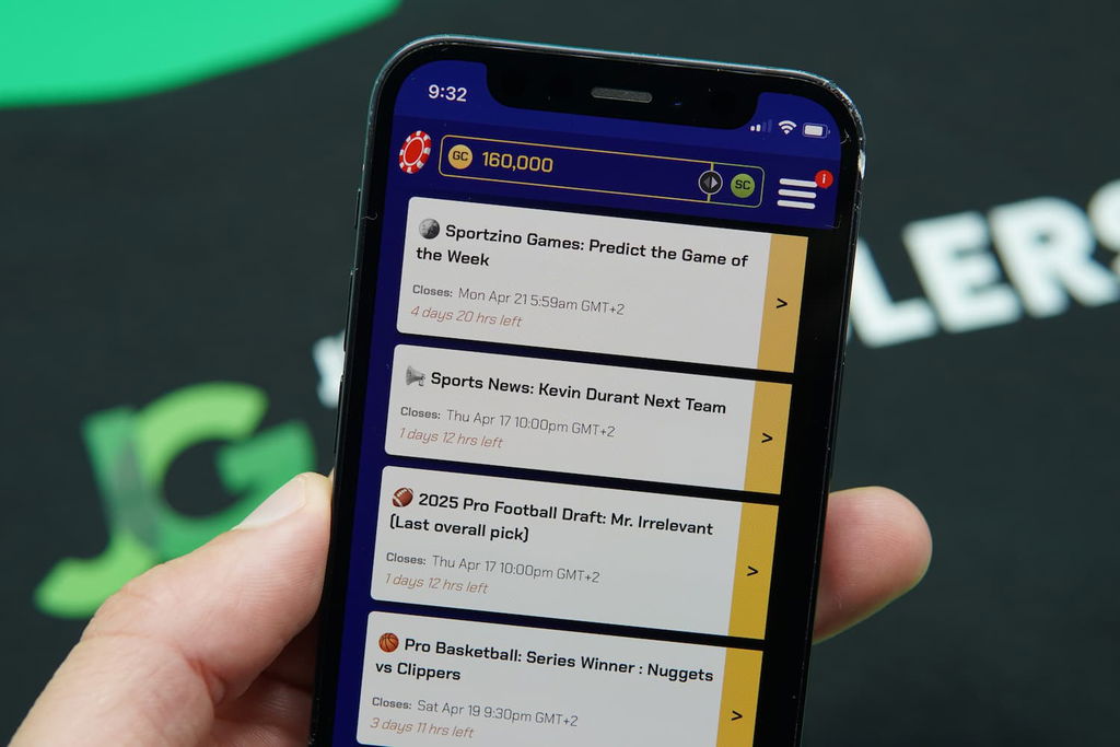 Patrik Lidin holding an iPhone with the Sportzino casino predictions page loaded on the webpage.